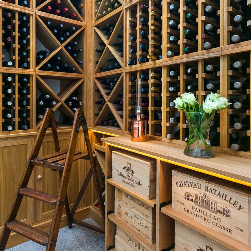 Floor to ceiling of wooden wine racking.