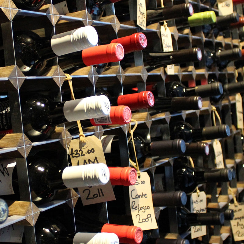 Large wine storage featuring wood and metal.