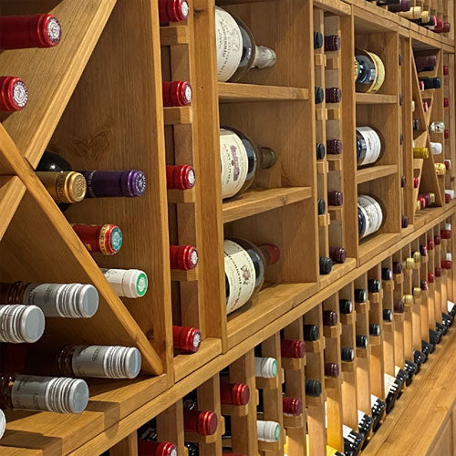 A side angle image of wooden wine racking.