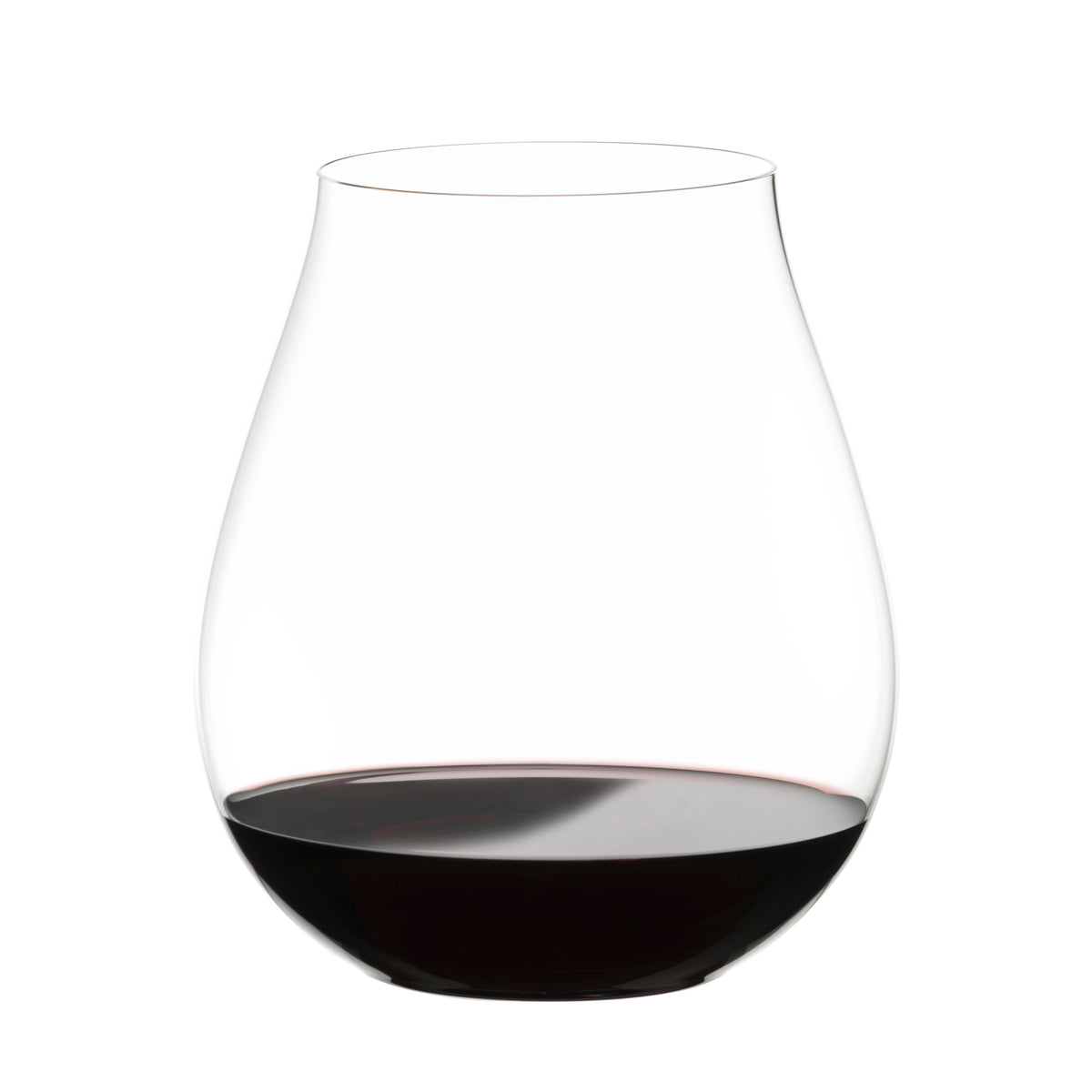 A Riedel O Range Stemless New World Pinot Noir glass from the set of two (0414/67), featuring elegant crystal design and dishwasher-safe convenience, holds a small amount of red wine on a white background.