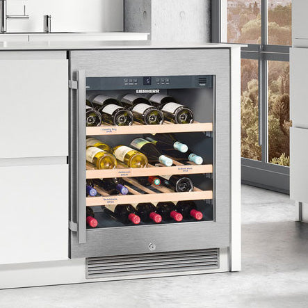 An undercounter Liebherr wine fridge in a mordern kitchen.