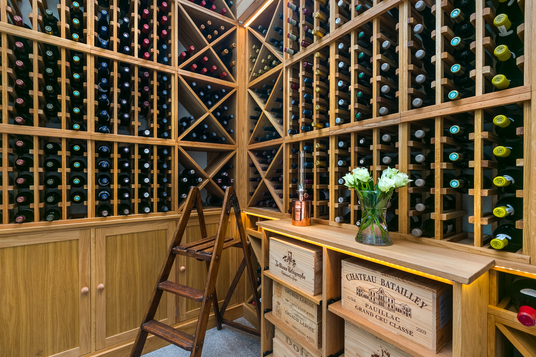 Modern wooden wine storage from floor to ceiling.