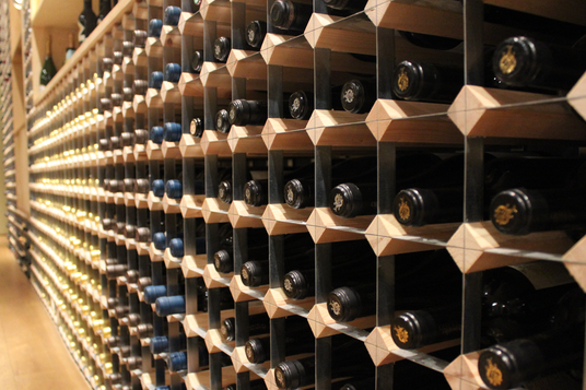 Large wine storage featuring wood and metal.