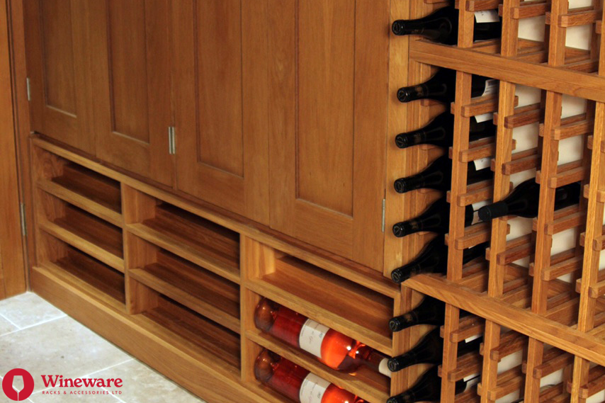Wooden wine cellar with wine bottles and Wineware branding.