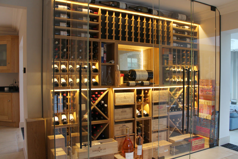 Modern wine cellar with bottles and storage shelves.
