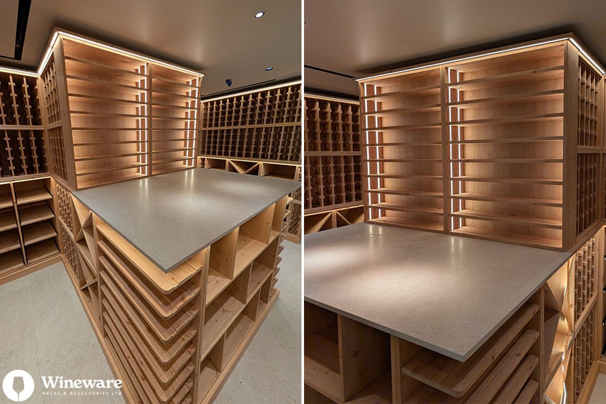 Wooden wine cellar with shelves and a central table, featuring Wineware branding.