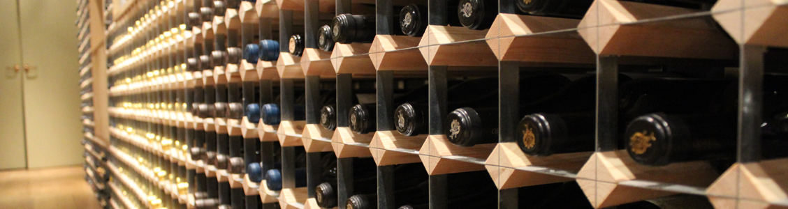 Close up wood and metal traditional wine racking.