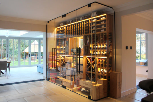 Modern home with a large glass-enclosed wine cellar.