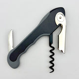 The Soft Touch 001 Single Lever Waiter's Friend Corkscrew by Soft Touch is displayed on a white background, featuring a black and silver design with a serrated foil cutter, bottle opener, and spiral worm.