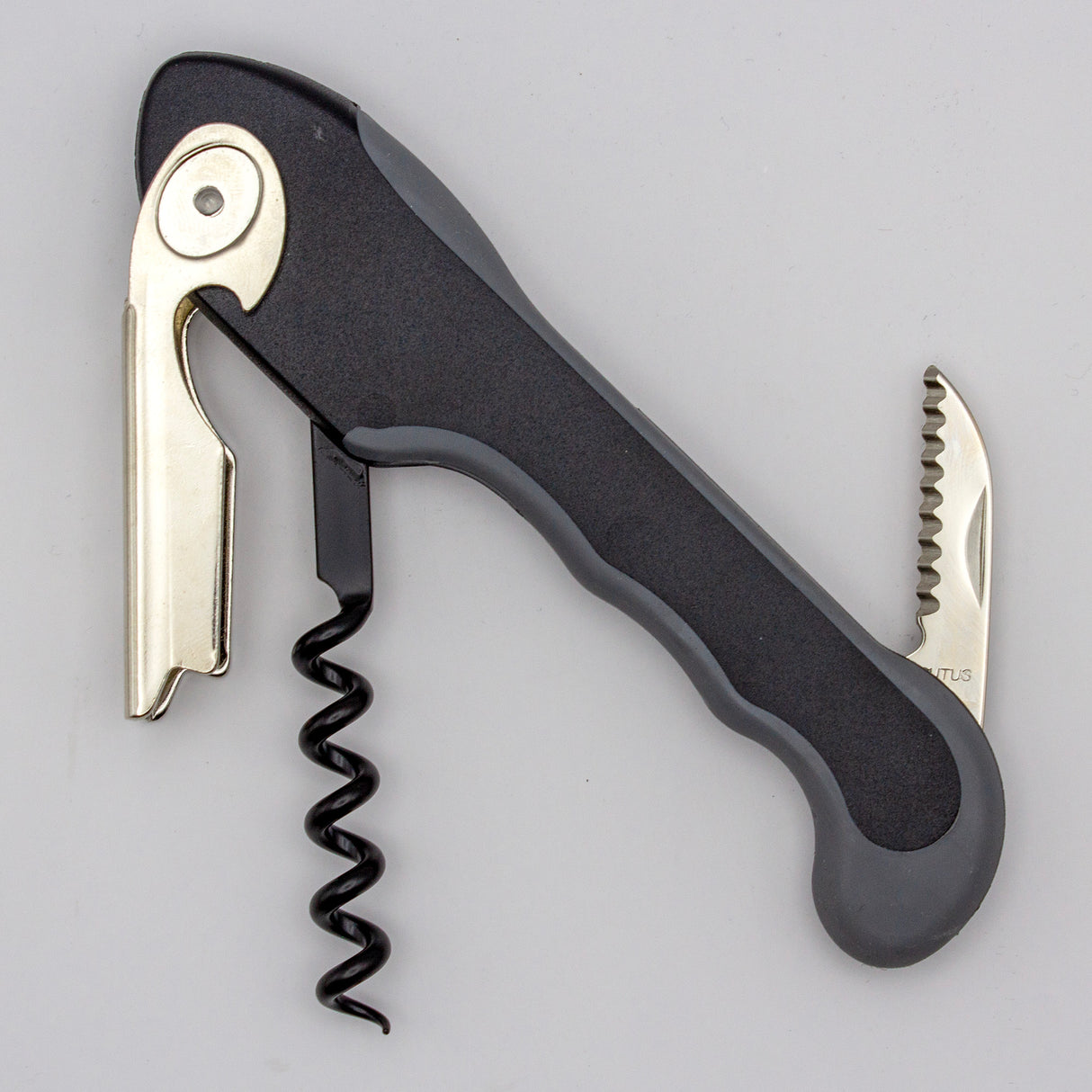 The Soft Touch 001 Single Lever Waiter's Friend Corkscrew by Soft Touch is a sleek black and silver tool featuring a bottle opener, serrated foil cutter, and spiral worm, displayed against a plain light gray background.