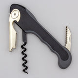 The Soft Touch 001 Single Lever Waiter's Friend Corkscrew by Soft Touch is a sleek black and silver tool featuring a bottle opener, serrated foil cutter, and spiral worm, displayed against a plain light gray background.