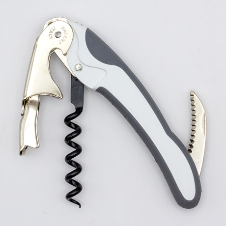 The Soft Touch 002 Double Lever Waiter's Friend Corkscrew by Soft Touch is a metal and plastic wine opener featuring a foldable double lever, integrated bottle opener, and small serrated knife, designed for efficiently opening wine bottles.