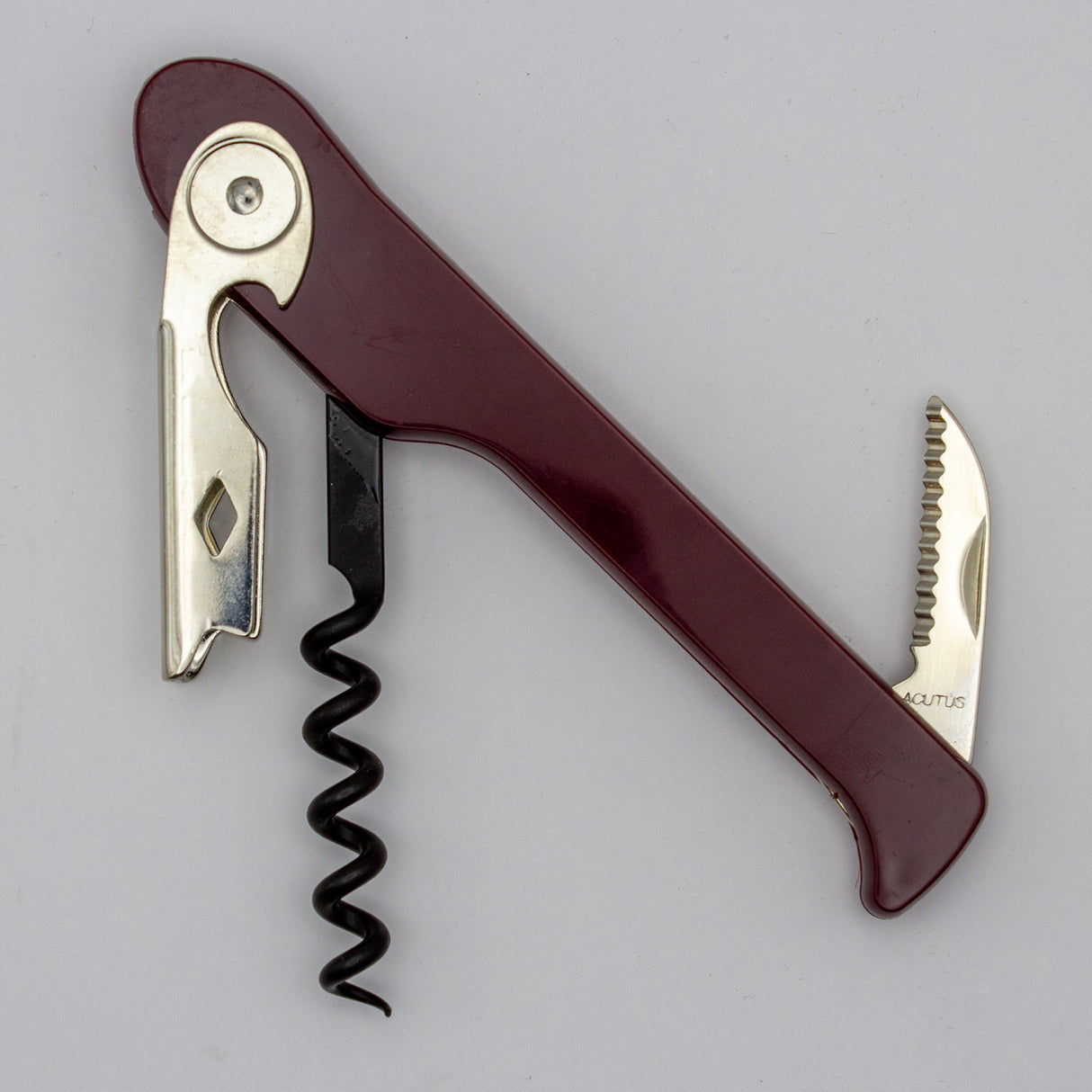 A Soft Touch 003 Single Lever Waiter's Friend Corkscrew by Soft Touch, featuring a maroon and silver finish with a bottle opener, foil cutter, and spiral helix, is shown against a plain light gray background.