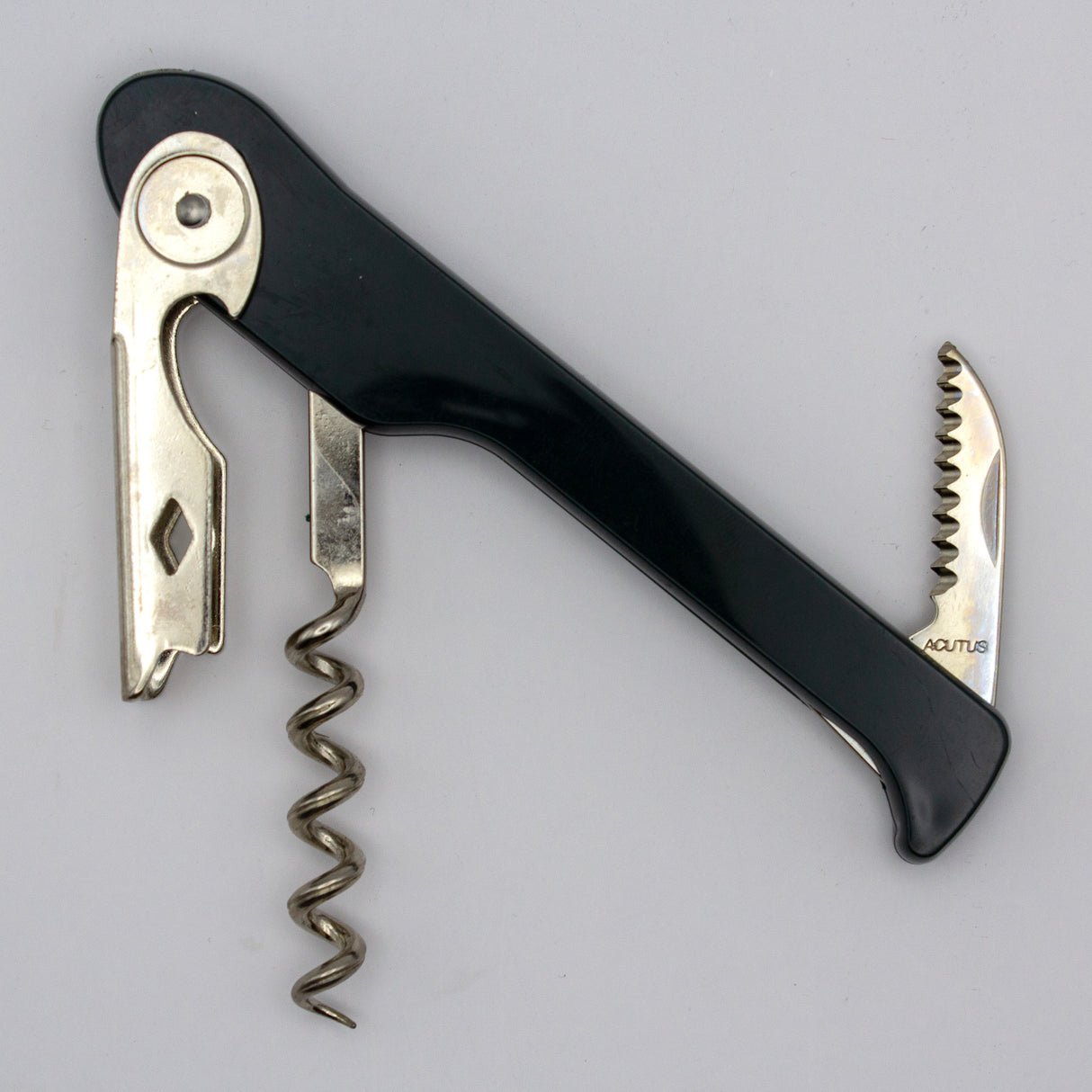 A Soft Touch 003 Single Lever Waiter's Friend Corkscrew by Soft Touch, in black and silver, featuring a bottle opener, foil cutter, and spiral screw, is photographed on a plain light background.