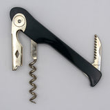 A Soft Touch 003 Single Lever Waiter's Friend Corkscrew by Soft Touch, in black and silver, featuring a bottle opener, foil cutter, and spiral screw, is photographed on a plain light background.
