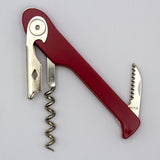 A Soft Touch 003 Single Lever Waiter's Friend Corkscrew by Soft Touch, featuring a red handle, integrated bottle opener, and a small serrated knife attachment, is pictured on a plain white background.