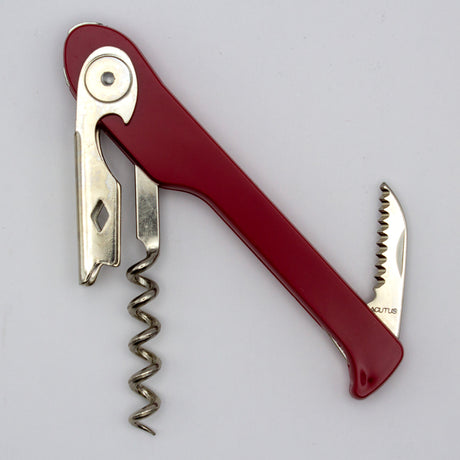 A Soft Touch 003 Single Lever Waiter's Friend Corkscrew by Soft Touch, featuring a red handle, integrated bottle opener, and a small serrated knife attachment, is pictured on a plain white background.