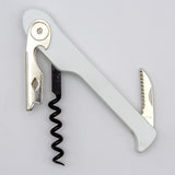 The Soft Touch 003 Single Lever Waiter's Friend Corkscrew by Soft Touch, in white, features a metal bottle opener, a spiral screw, and a small serrated knife—all folded out and displayed against a plain background.