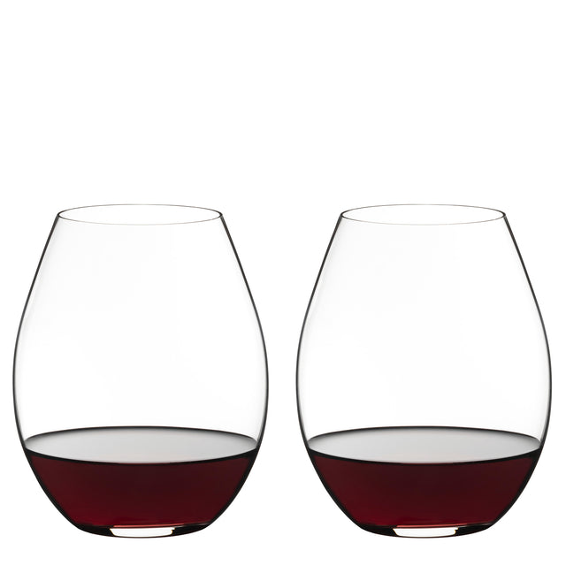 Two Riedel O Range Stemless Old World Syrah Glasses (Set of 2) by Riedel, each partially filled with red wine, are placed side by side against a plain white background. With their modern silhouette, these glasses are both elegant and fully dishwasher safe for convenient cleanup.