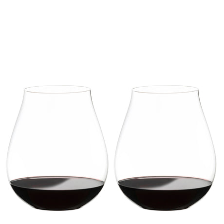 Two Riedel O Range Stemless New World Pinot Noir glasses by Riedel, each filled with red wine to about one quarter full, are placed side by side on a white background. These elegant crystal glasses come as a set of two (model 0414/67) and are both visually striking and dishwasher safe for effortless cleanup.