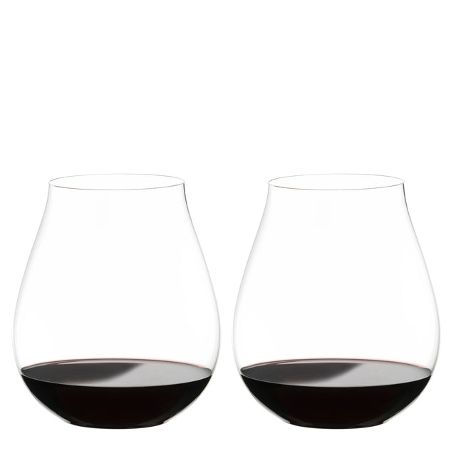 Two Riedel O Range Stemless New World Pinot Noir glasses by Riedel, each filled with red wine to about one quarter full, are placed side by side on a white background. These elegant crystal glasses come as a set of two (model 0414/67) and are both visually striking and dishwasher safe for effortless cleanup.