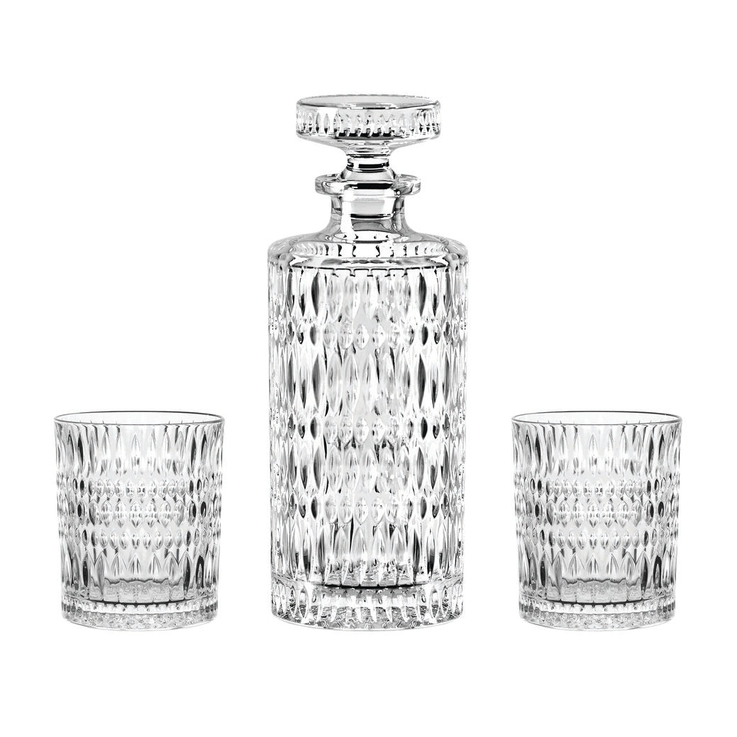 The Nachtmann Ethno Whisky Decanter & Two Glass Set by Nachtmann features an elegant crystal decanter with a stopper, accompanied by two matching whisky tumblers, all adorned with a sophisticated diamond-cut pattern.