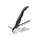 The Pulltex Pulltap Wine Essentials Waiter’s Friend Double Lever Corkscrew by Pulltex, featuring a black handle, integrated bottle opener, small knife, and a helix-shaped screw, is shown standing on a white background.
