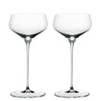Two empty, clear Spiegelau Hi-Lite Coupette / Cocktail Saucers by Spiegelau, each featuring an elegant long stem, stand side by side against a white background.