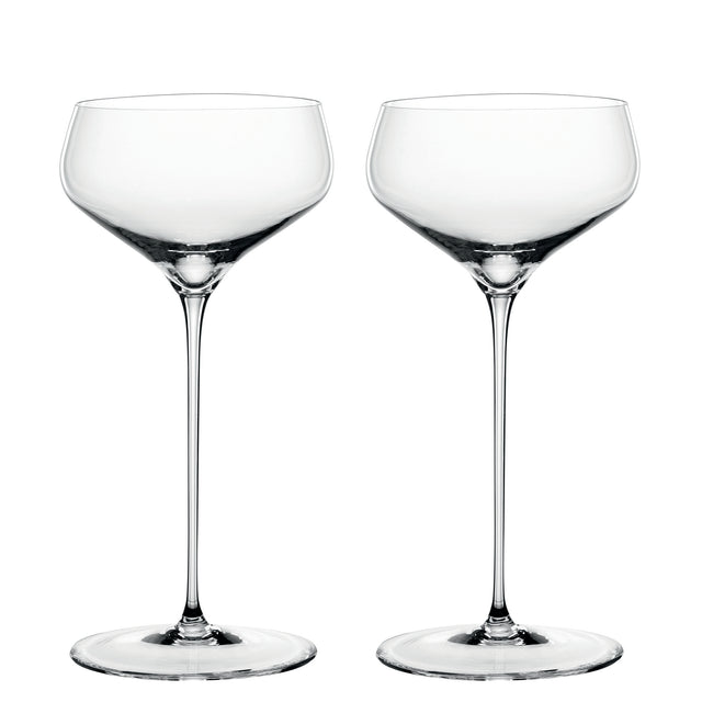 Two empty, clear Spiegelau Hi-Lite Coupette / Cocktail Saucers by Spiegelau, each featuring an elegant long stem, stand side by side against a white background.
