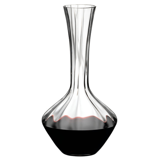 A Riedel Manufaktur Exquisit Wine Decanter 1.2L by Riedel, featuring a wide base that narrows at the neck, is partially filled with red wine.