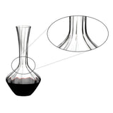 A clear Riedel Manufaktur Exquisit Wine Decanter 1.2L (2025/02), partially filled with red wine, features a close-up inset highlighting the smooth, curved neck as it transitions into the bulbous base. This elegant, handmade decanter by Riedel exemplifies refined craftsmanship and timeless design.