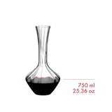 A stunning Riedel Manufaktur Exquisit Wine Decanter 1.2L - 2025/02, crafted from clear crystal, gracefully displays red wine filled to about one-third of its capacity. Text beside the decanter states: 1.2 L, 40.58 oz. This elegant piece by Riedel is designed to elevate your wine experience.