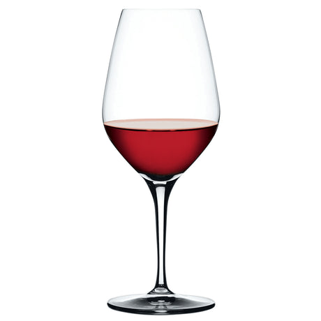 A Spiegelau Restaurant Authentis Red Wine Glass (480ml) from the set of 12, partially filled with red wine, stands elegantly on a white background.