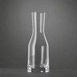 A clear, empty Spiegelau Ultra Wine / Water Carafe 500ml by Spiegelau stands upright on a dark surface against a plain gray background.