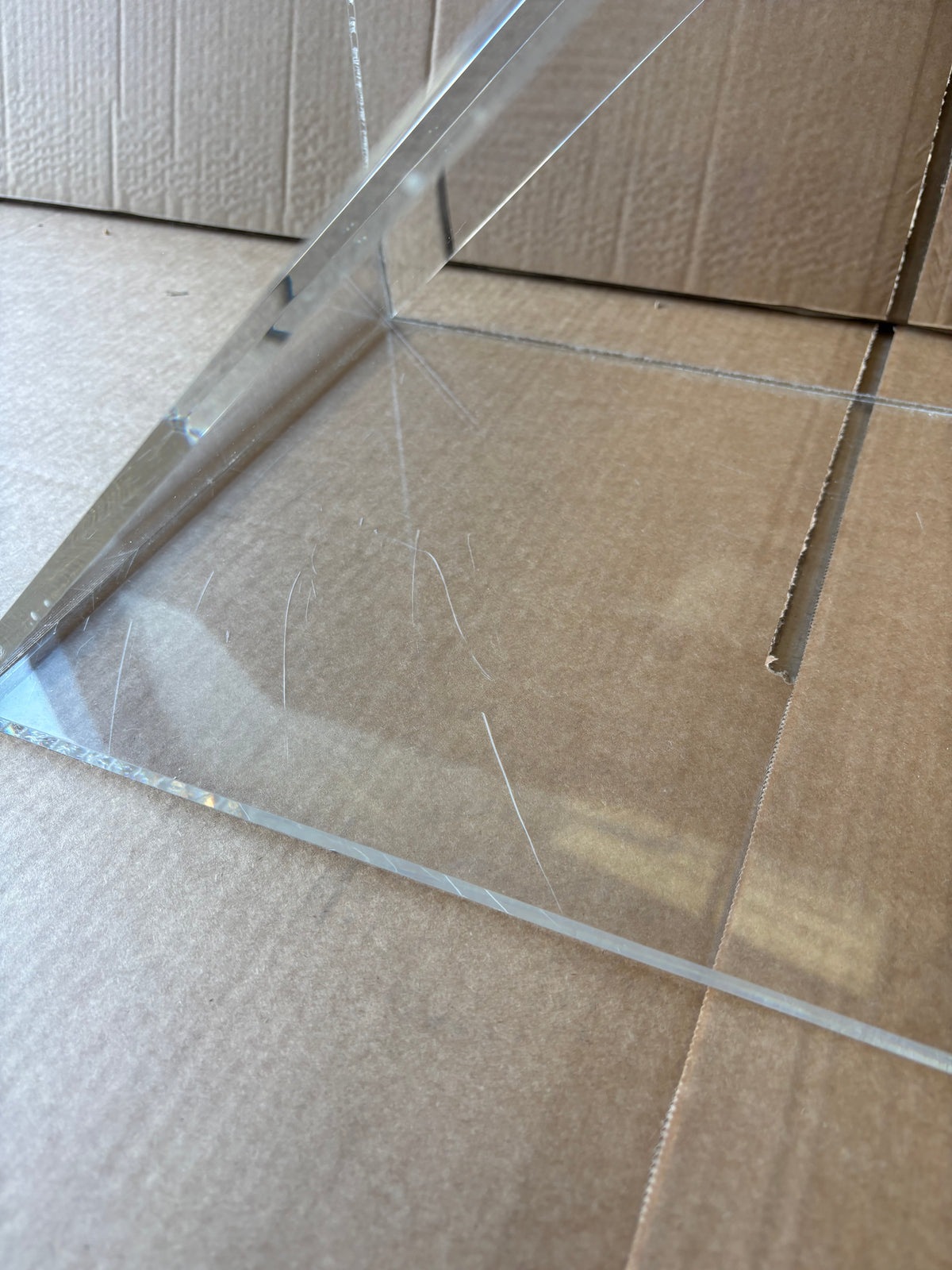 Ex-Display Clear Perspex Wine Cube – 300mm Deep - Approx. 24 Bottles, a clear acrylic wine display cube with visible surface scratches.