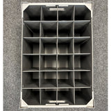 A top-down view of an empty Wineware Wine Glass Storage Box (USED - GREAT CONDITION, 230mm high, 24 cells) placed on a gray carpeted floor.
