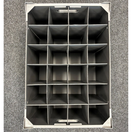 A top-down view of an empty Wineware Wine Glass Storage Box (USED - GREAT CONDITION, 230mm high, 24 cells) placed on a gray carpeted floor.