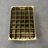 A Wineware USED - GREAT CONDITION Wine Glass Storage Box, beige with 35 compartments and 140mm height, is shown on a grey carpeted floor, viewed from above.