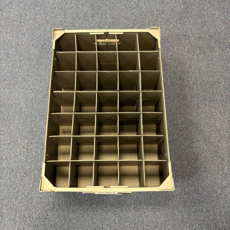 A Wineware USED - GREAT CONDITION Wine Glass Storage Box, beige with 35 compartments and 140mm height, is shown on a grey carpeted floor, viewed from above.