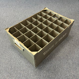 The Wineware USED - GREAT CONDITION Wine Glass Storage Box (190mm high, 35 cells) is a gray plastic organizer with handles and white side labels, ideal for safely storing delicate glassware. Seen here on a carpeted floor.