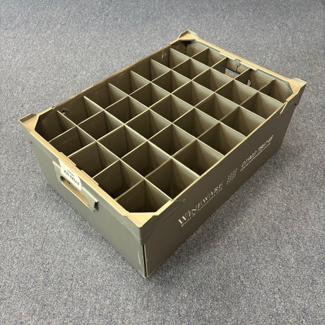 The Wineware USED - GREAT CONDITION Wine Glass Storage Box (190mm high, 35 cells) is a gray plastic organizer with handles and white side labels, ideal for safely storing delicate glassware. Seen here on a carpeted floor.
