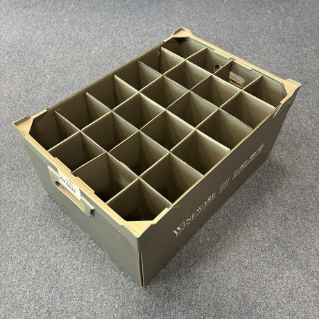 The Wineware USED - GREAT CONDITION Wine Glass Storage Box, 240mm high with 24 cells, features label slots and is ideal for organizing or transporting wine glasses. It’s made of gray polypropylene and rests on a gray carpeted floor.