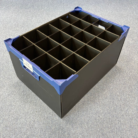 The USED - GREAT CONDITION Wineware Wine Glass Storage Box (255mm high, 24 cells) has durable polypropylene construction, blue reinforced corners, a label for identification, and is shown on a gray carpeted floor.
