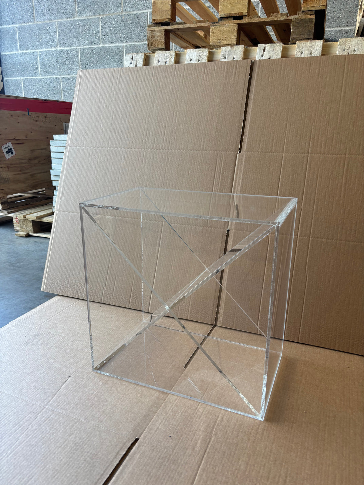 Ex-Display Clear Perspex Wine Cube – 300mm Deep - Approx. 24 Bottles: a clear acrylic wine storage cube with an X-shaped divider inside, serving as a modern wine display.