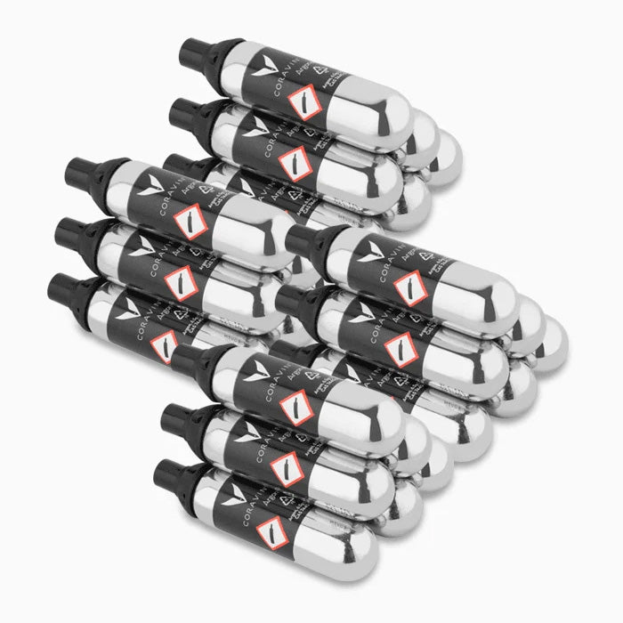 Twelve silver Coravin Pure Argon Gas Replacement Capsules with black nozzles, arranged in two rows for wine preservation.