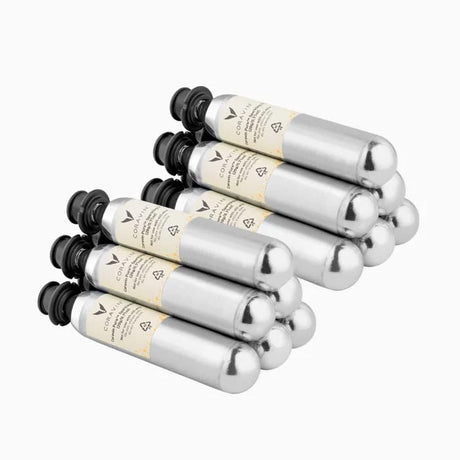 Six silver Coravin Pure Sparkling Wine CO2 Capsules with black screw caps, arranged in two rows of three.