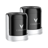 Two black and silver Coravin Sparkling Wine Stoppers from Coravin are displayed side by side, each featuring the brand’s logo on the front. The Coravin Sparkling Wine Stopper - Set of 2 is designed for use with the Sparkling Wine Preservation System to help keep your sparkling wine bottles fresh and bubbly for longer.