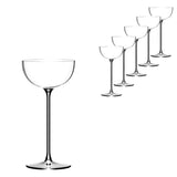 Six empty coupe glasses, including the stylish Lehmann Glass La Creative London Cocktail Coupe 200ml from Lehmann Glass, are lined up diagonally on a white background, with one glass shown larger in the foreground on the left and five gradually smaller glasses arranged behind it to the right.