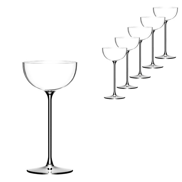 Six empty coupe glasses, including the stylish Lehmann Glass La Creative London Cocktail Coupe 200ml from Lehmann Glass, are lined up diagonally on a white background, with one glass shown larger in the foreground on the left and five gradually smaller glasses arranged behind it to the right.