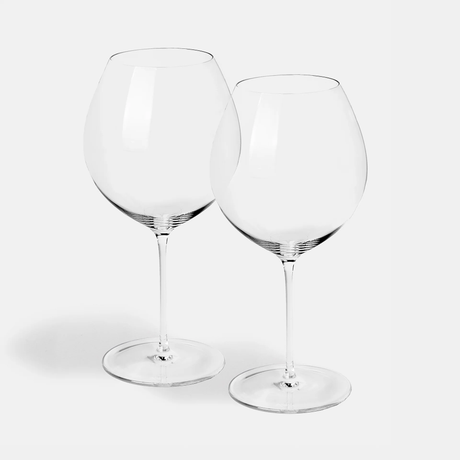 The Jancis Robinson x Richard Brendon The Occasional Collection Burgundy Wine Glass set features two mouth-blown crystal glasses with long stems, side by side on a white surface against a plain white background.